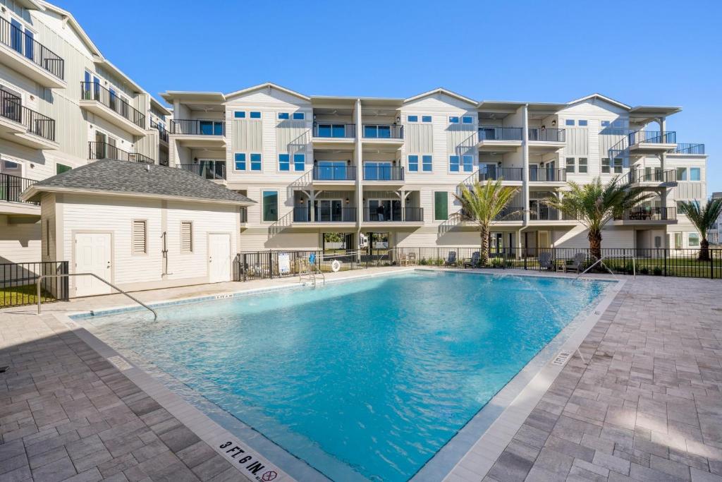 a swimming pool in front of a apartment building at Sharkey's by Pristine Properties Vacation Rentals in Cape San Blas