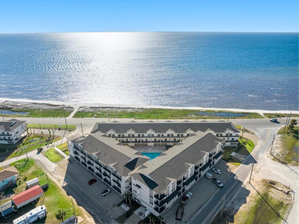 an aerial view of a building next to the ocean at Sharkey's by Pristine Properties Vacation Rentals in Cape San Blas