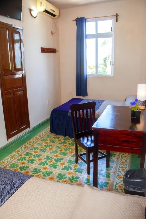 Postel nebo postele na pokoji v ubytování Hotel Cortaza Galería