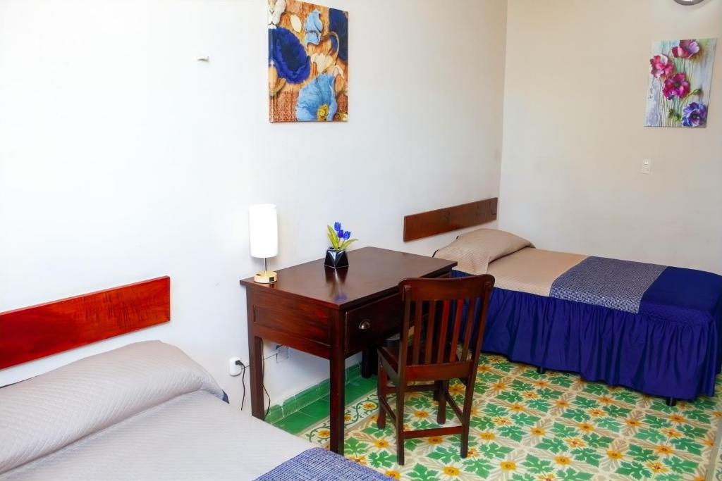 Postel nebo postele na pokoji v ubytování Hotel Cortaza Galería