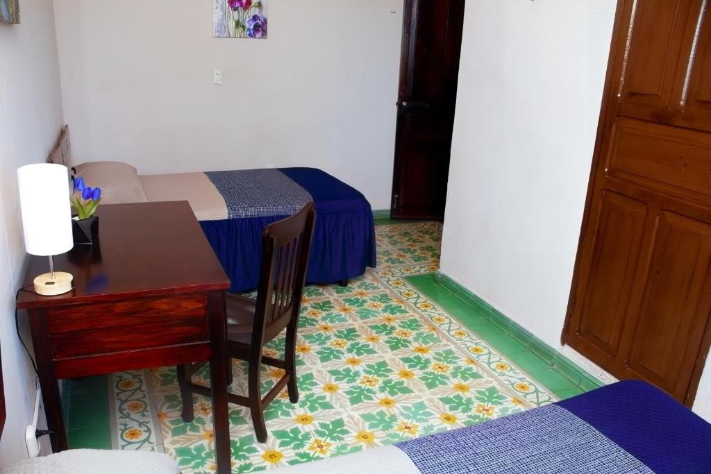 Postel nebo postele na pokoji v ubytování Hotel Cortaza Galería