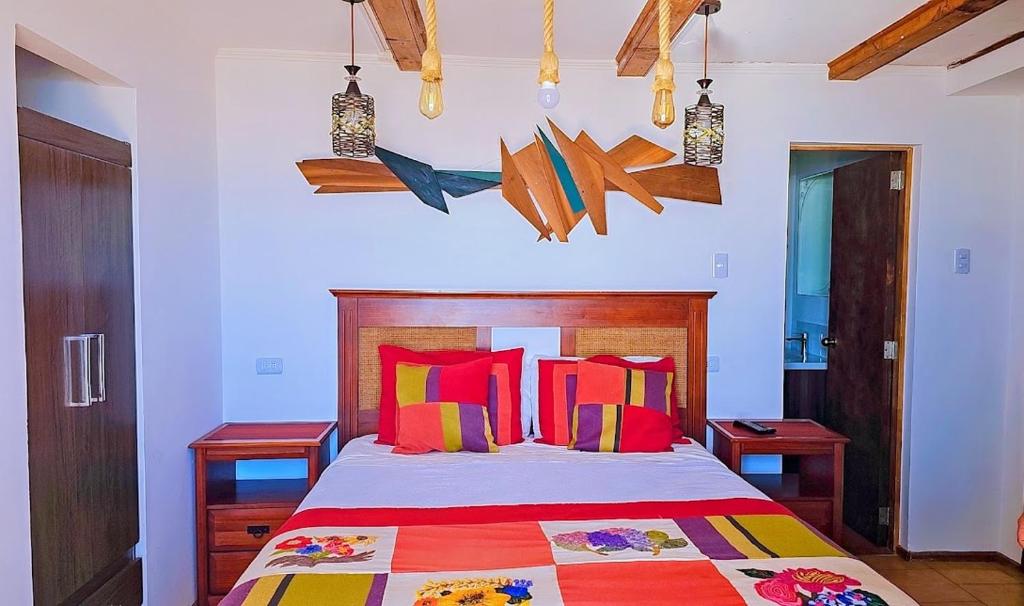 Una cama o camas en una habitación de Hosteria Iloca