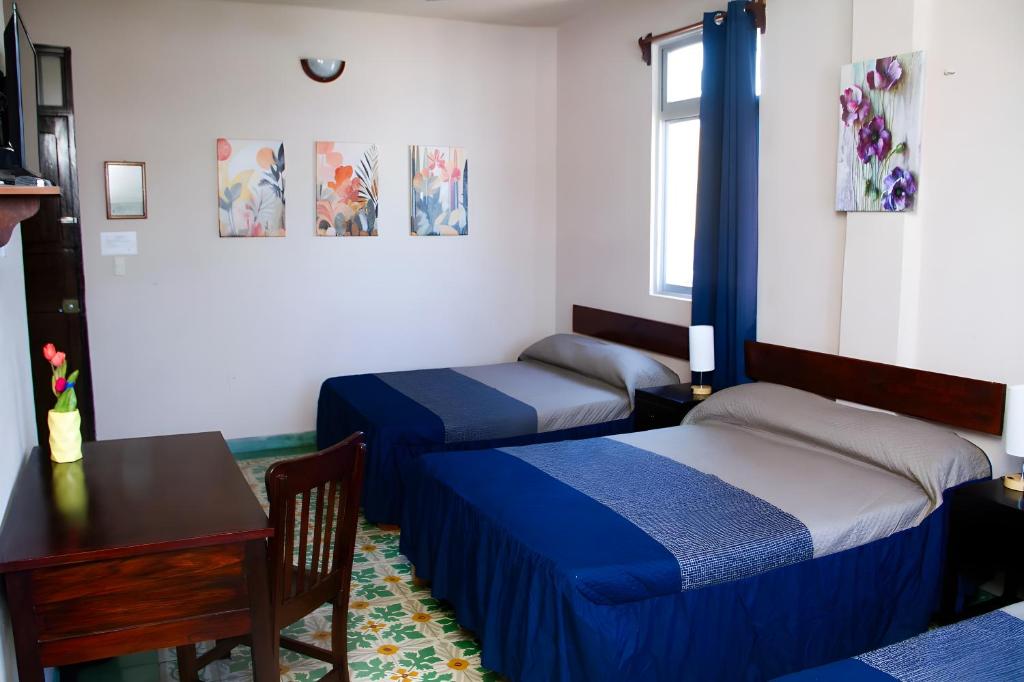 Postel nebo postele na pokoji v ubytování Hotel Cortaza Galería