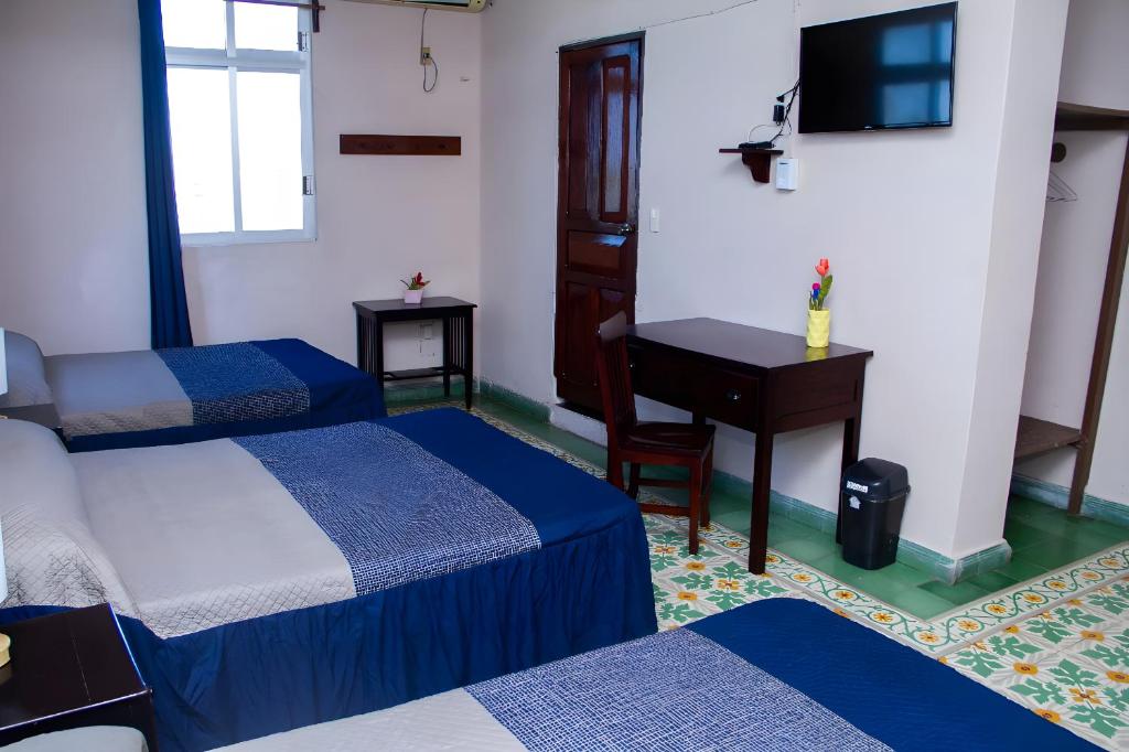 Postel nebo postele na pokoji v ubytování Hotel Cortaza Galería