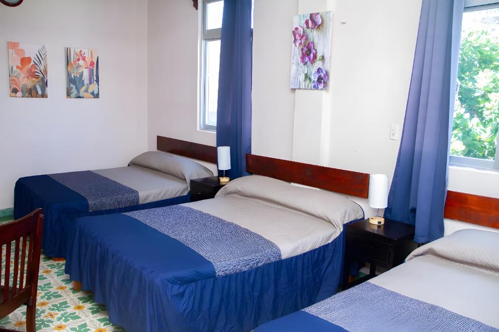 Postel nebo postele na pokoji v ubytování Hotel Cortaza Galería
