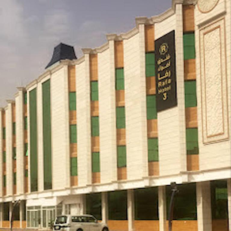 a building with a car parked in front of it at شقق اضواء رفا للشقق المخدومة in Al Kharj