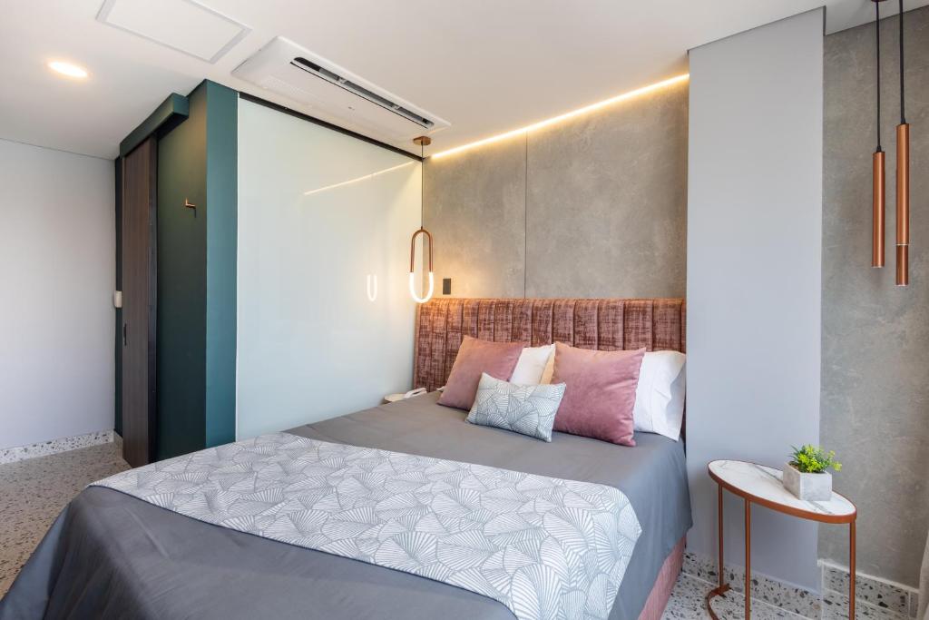 Postel nebo postele na pokoji v ubytování Glow Medellín