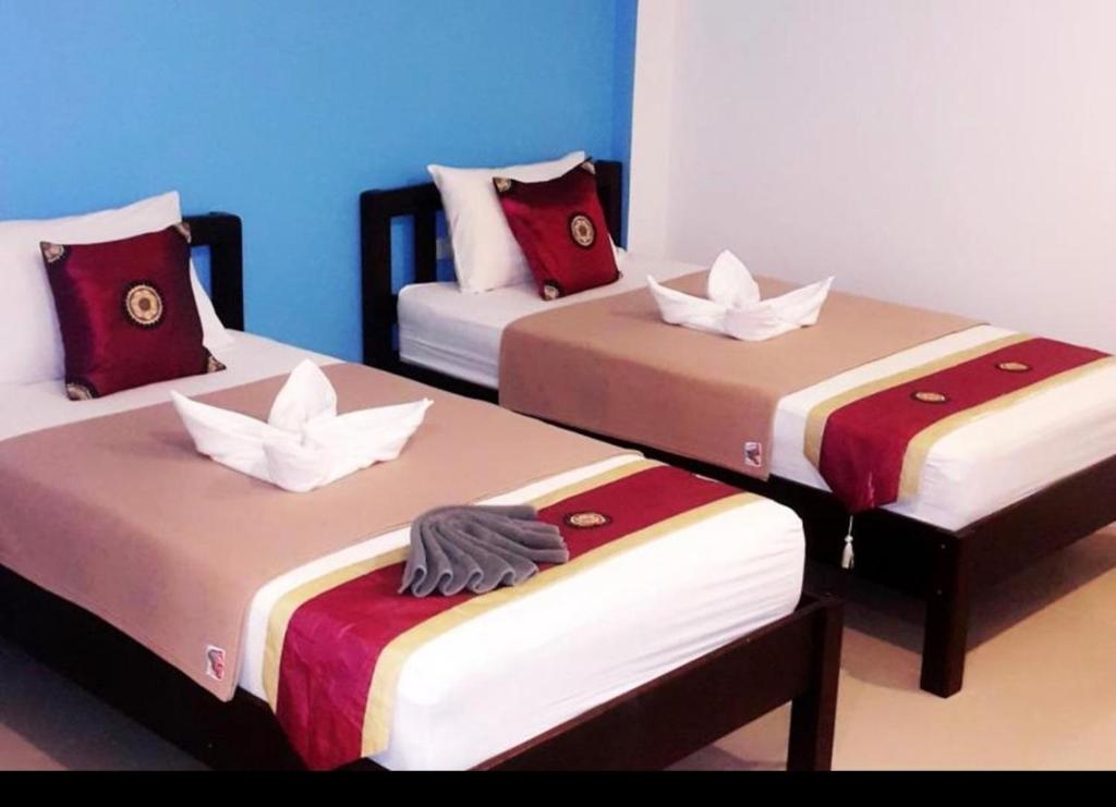 Postel nebo postele na pokoji v ubytování Phangan Guest House