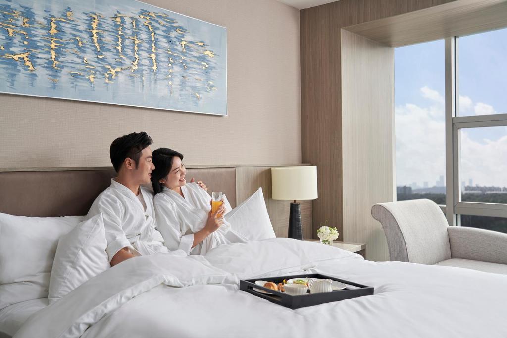 Postel nebo postele na pokoji v ubytování Nanning Marriott Hotel