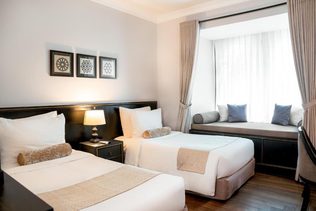 Postel nebo postele na pokoji v ubytování Sarai and Wander Hotel