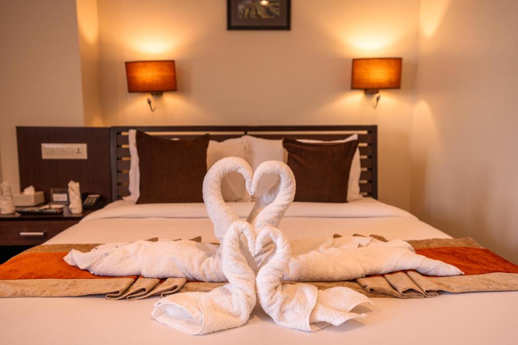 Postel nebo postele na pokoji v ubytování The Luxe Inn Boutique Hotel