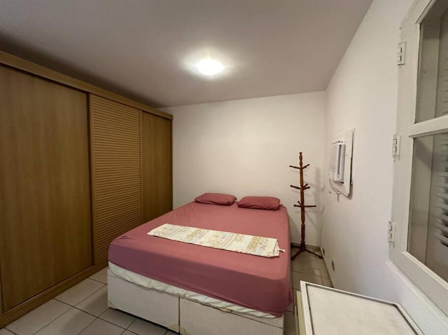 a small bedroom with a bed in a room at Casa Vl Mariana-Próx SP Expo-com garagem in Sao Paulo