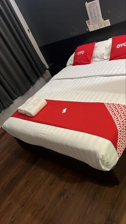 Postel nebo postele na pokoji v ubytování Dung Fang Hotel No 1 Sibu