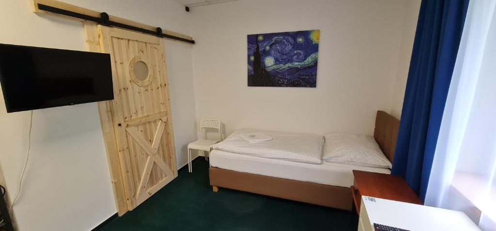 Postel nebo postele na pokoji v ubytování Apartmány Orlová