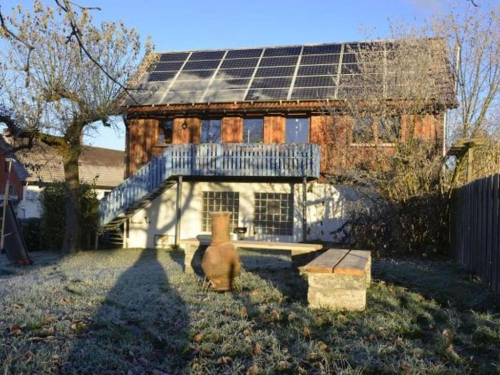 a house with solar panels on top of it at Holiday home Keim Comfortable Vacation Home in Negenborn
