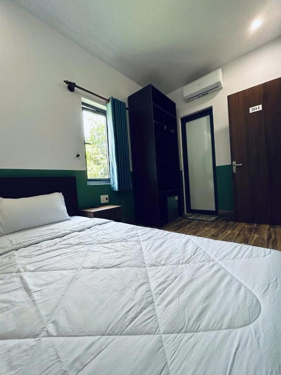 Postel nebo postele na pokoji v ubytování Nineties homestay