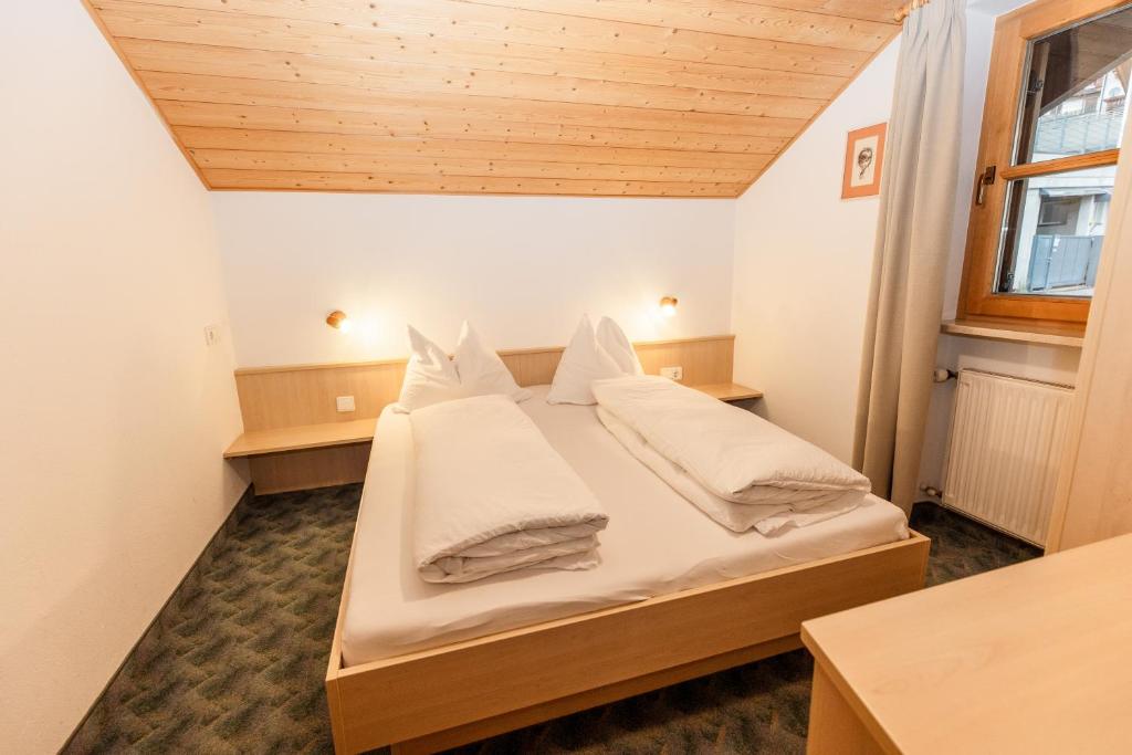 Postel nebo postele na pokoji v ubytování Apartment Obkircher