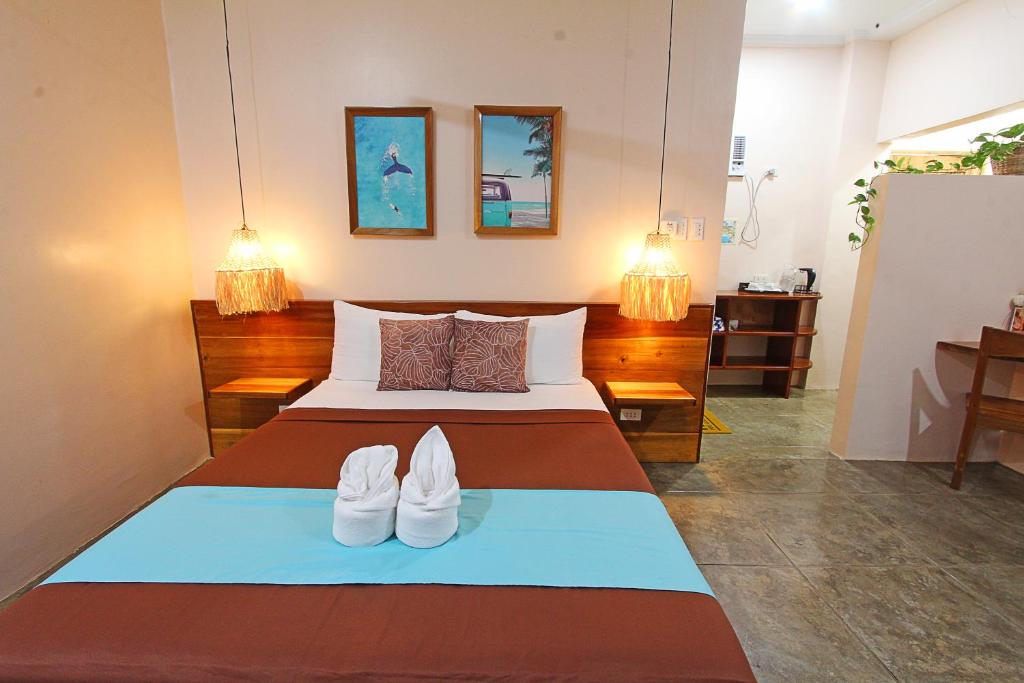 Postel nebo postele na pokoji v ubytování Yapak Beach Villas