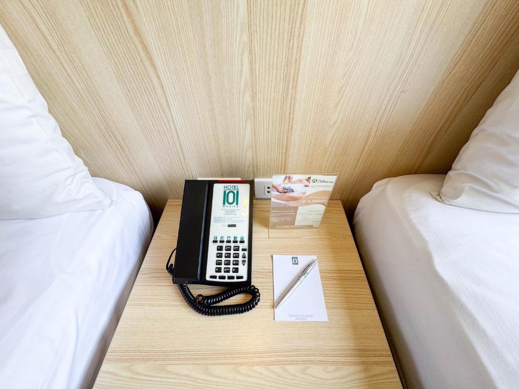Voodi või voodid majutusasutuse Hotel101 - Manila toas