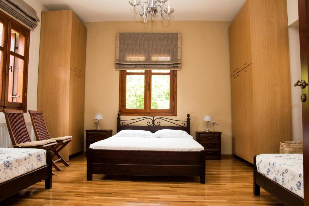 Postel nebo postele na pokoji v ubytování Villa Vlatos