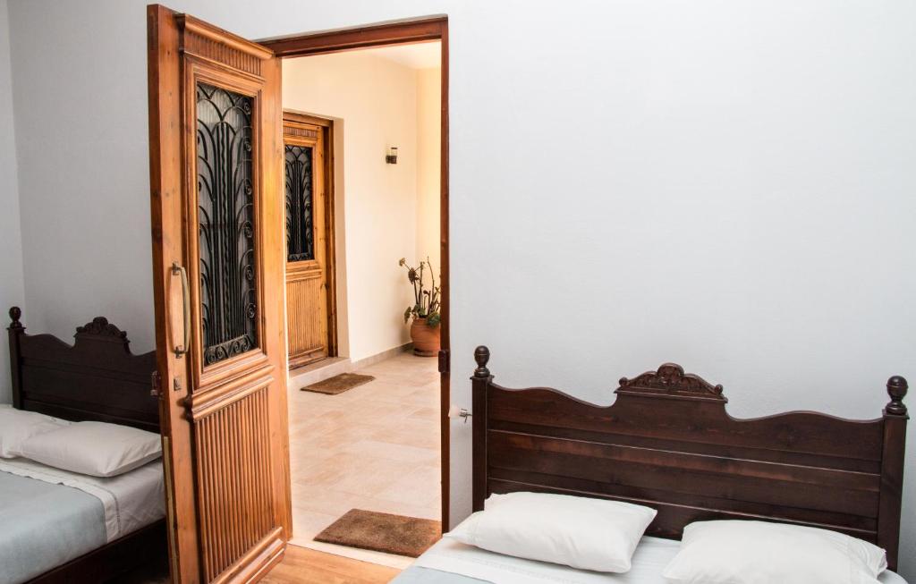 Postel nebo postele na pokoji v ubytování Villa Vlatos