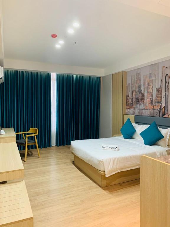 Postel nebo postele na pokoji v ubytování Fan's Hotel Palo