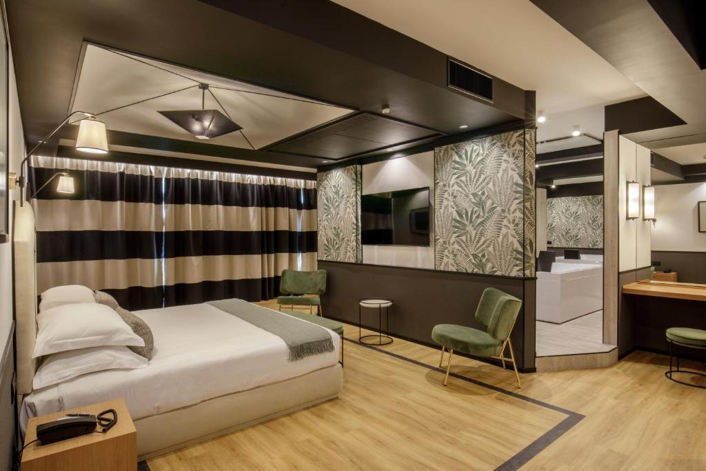 Postel nebo postele na pokoji v ubytování Hotel Domidea