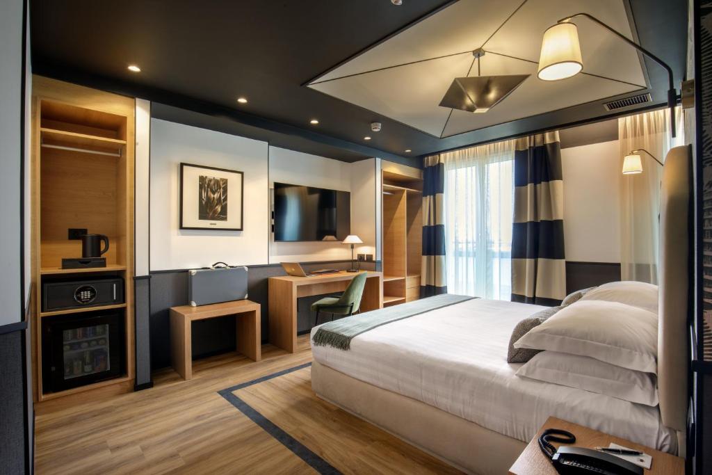 Postel nebo postele na pokoji v ubytování Hotel Domidea