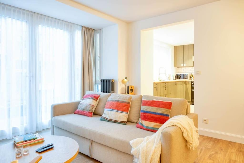a living room with a couch and a table at Chic 3-BR Oasis in Ghent - Stylish Interiors in Ghent