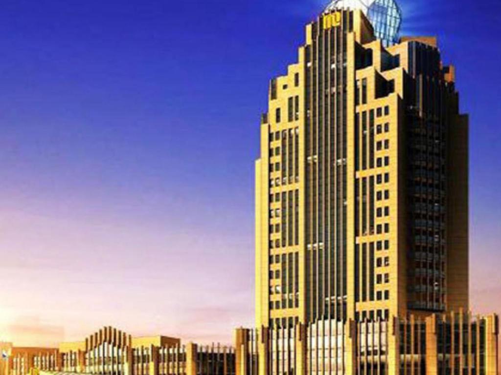 a rendering of a tall building in a city at Dezhou Regal Kangbo Hotel in Dezhou