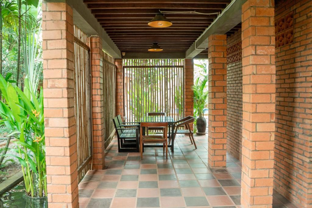 Balkón nebo terasa v ubytování Jungle Sanctuary Hotel Siem Reap