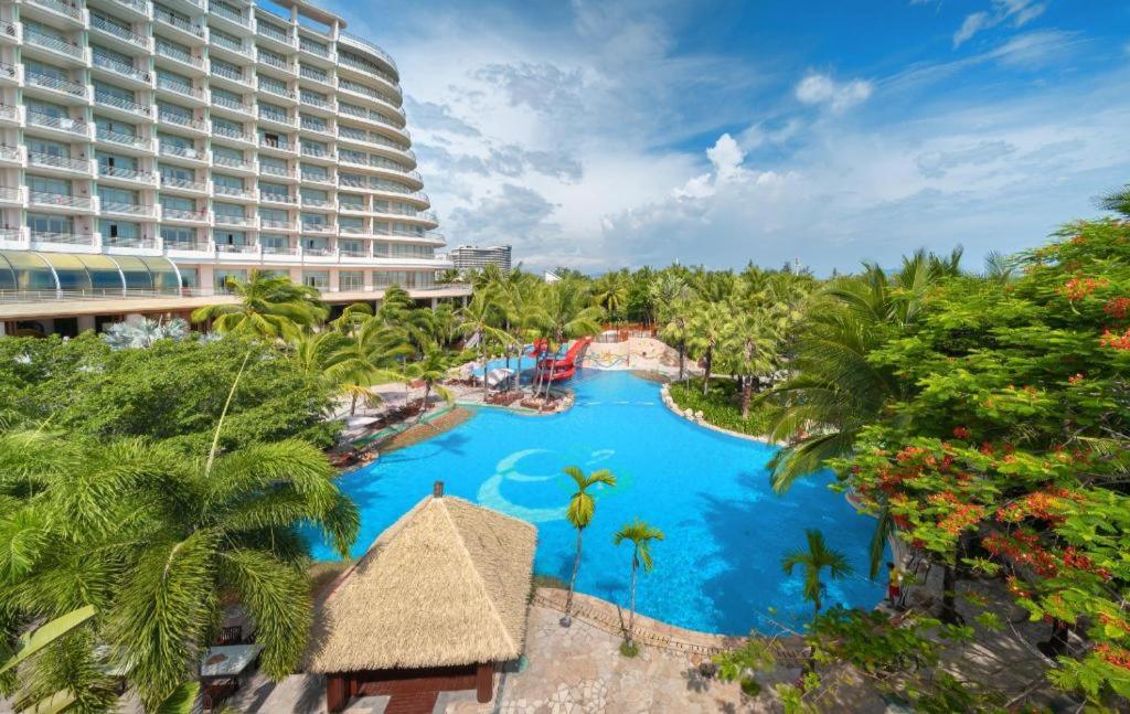 an aerial view of a resort with a pool at Grand Soluxe Hotel and Resort Sanya in Sanya