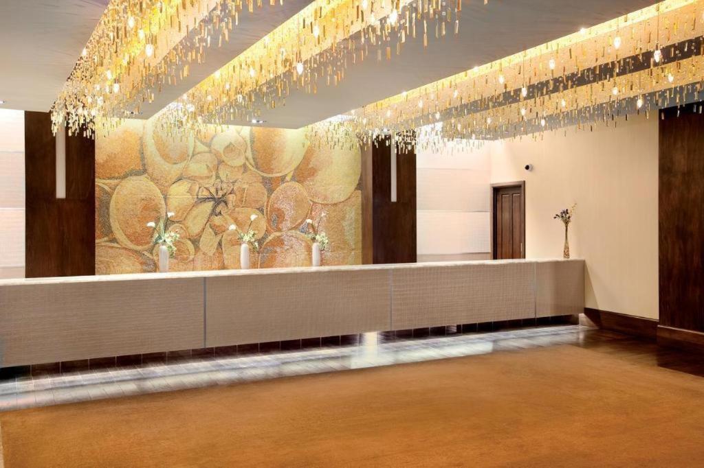a waiting room with a wall with chandeliers at Blue Chip Casino Hotel Spa in Michigan City