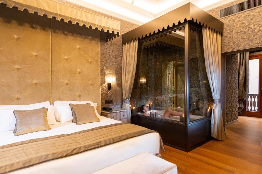 Postel nebo postele na pokoji v ubytování Hotel Canaletto