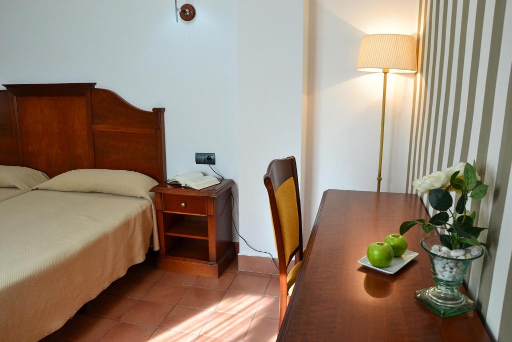 Postel nebo postele na pokoji v ubytování I AM La Posada Hotel and Apartment
