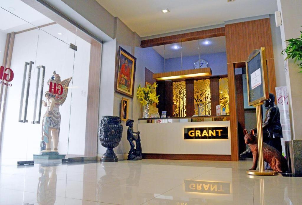 a store front with a sign that says grant in a store at Grant Hotel Subang in Bandung
