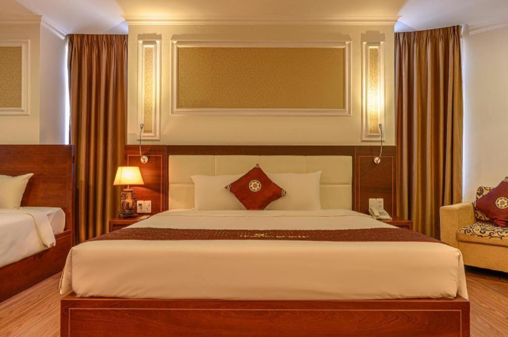 Ένα ή περισσότερα κρεβάτια σε δωμάτιο στο Ocean View Danang Hotel
