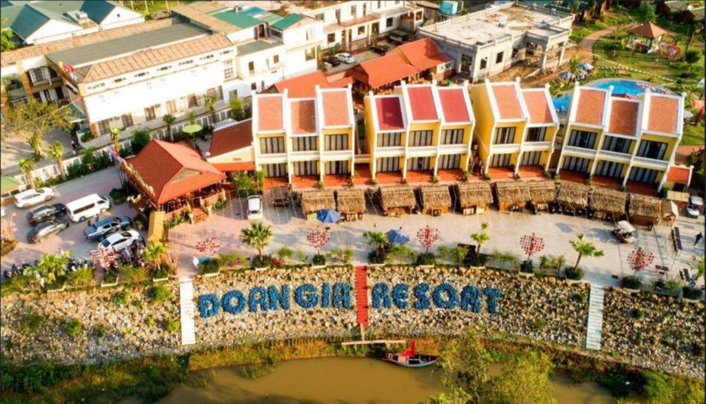 an overhead view of a town with a bridge and buildings at Doan Gia Resort in Phong Nha