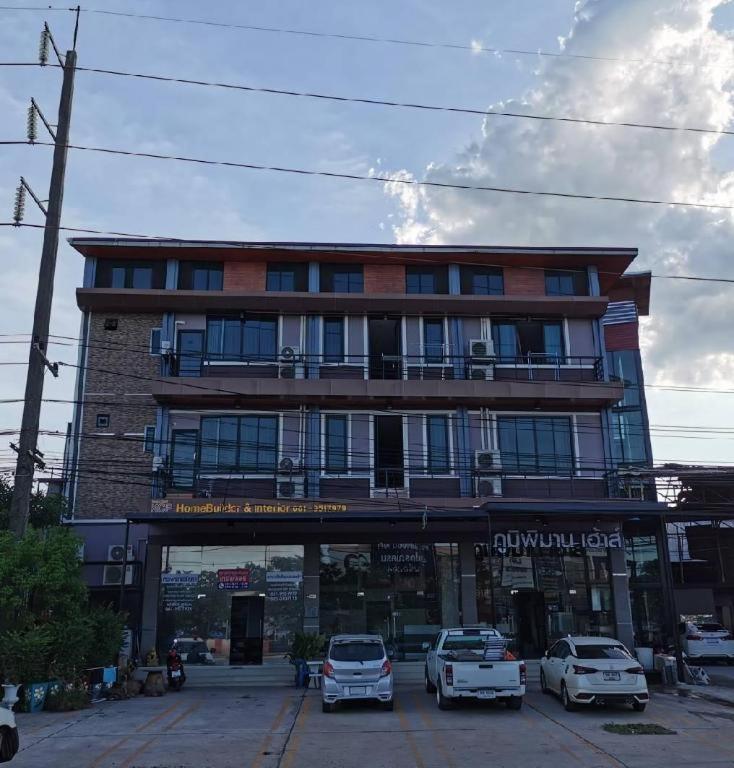 a large building with cars parked in front of it at Poompimaan House in Udon Border Police