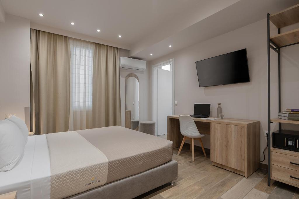 Postel nebo postele na pokoji v ubytování Piraeus City Hotel