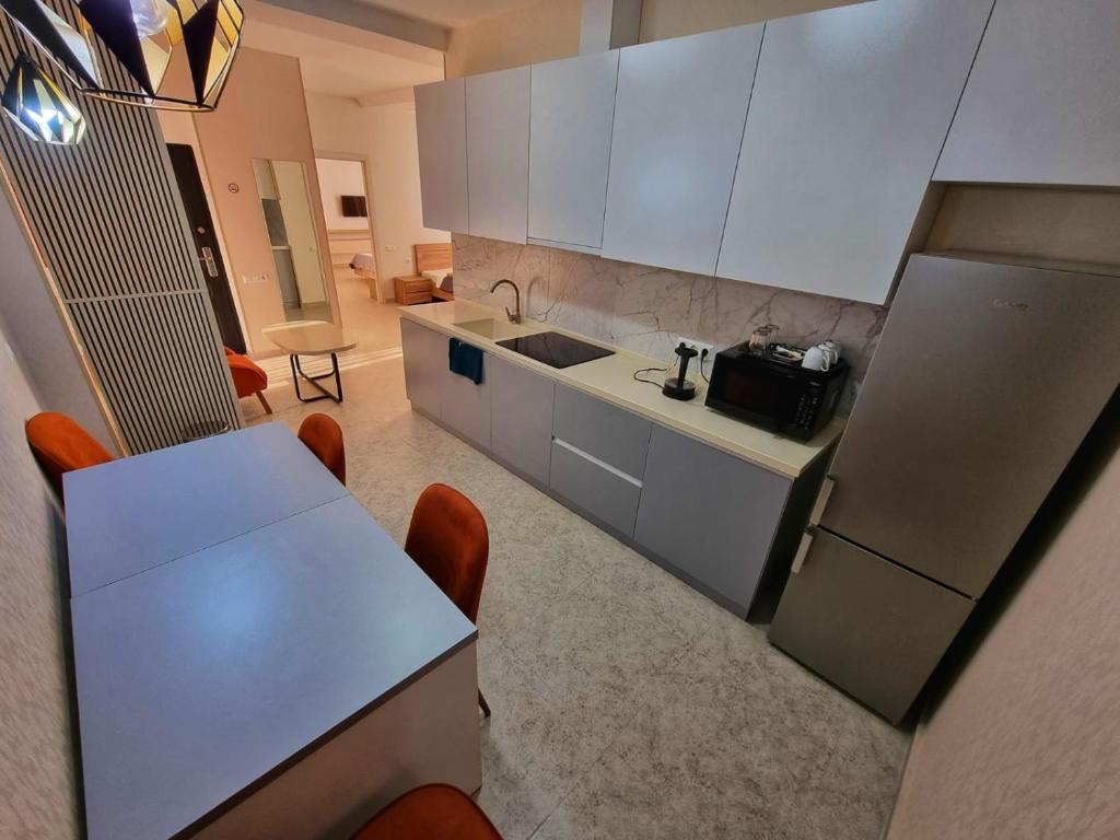 Kuchyň nebo kuchyňský kout v ubytování MD Apart Hotel Tbilisi