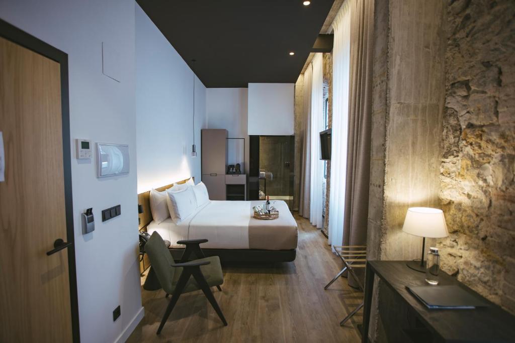 Postel nebo postele na pokoji v ubytování Hotel Luruna Palacio Larrinaga