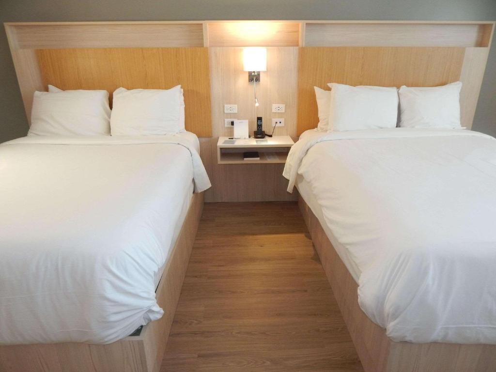 Postel nebo postele na pokoji v ubytování Radisson Colon 2,000 Hotel & Casino
