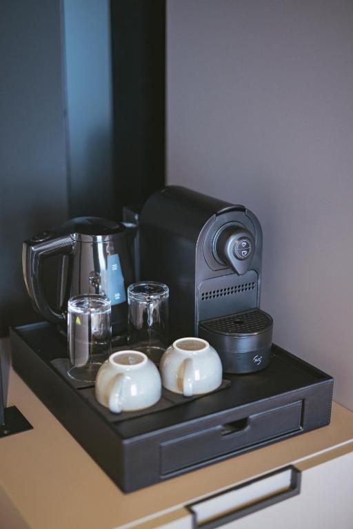 Příslušenství pro přípravu čaje a kávy v ubytování Hotel Luruna Palacio Larrinaga