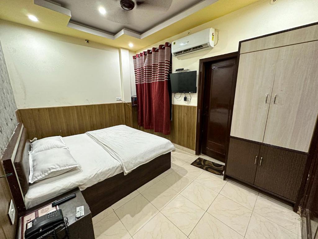 Postel nebo postele na pokoji v ubytování Hotel Ace