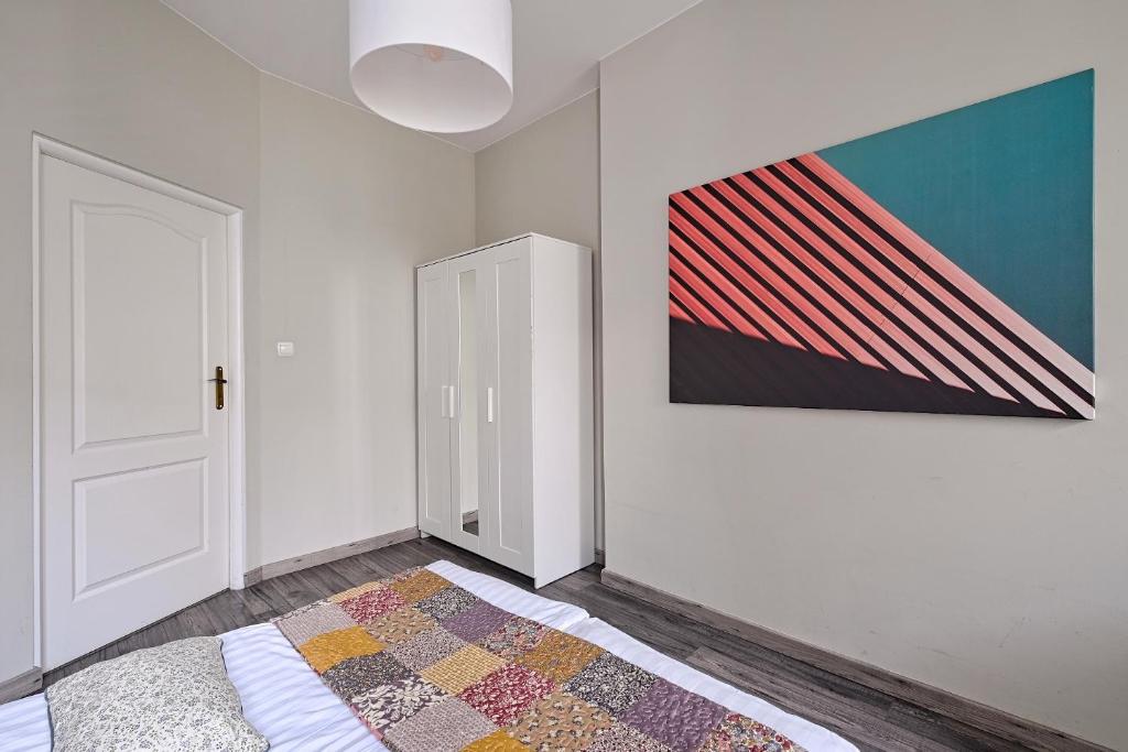 Posteľ alebo postele v izbe v ubytovaní Urban Nest Apartments Radziwiłłowska 14