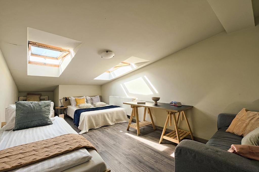 Posteľ alebo postele v izbe v ubytovaní Urban Nest Apartments Radziwiłłowska 14