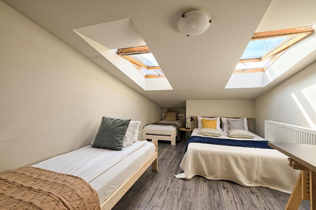 Posteľ alebo postele v izbe v ubytovaní Urban Nest Apartments Radziwiłłowska 14