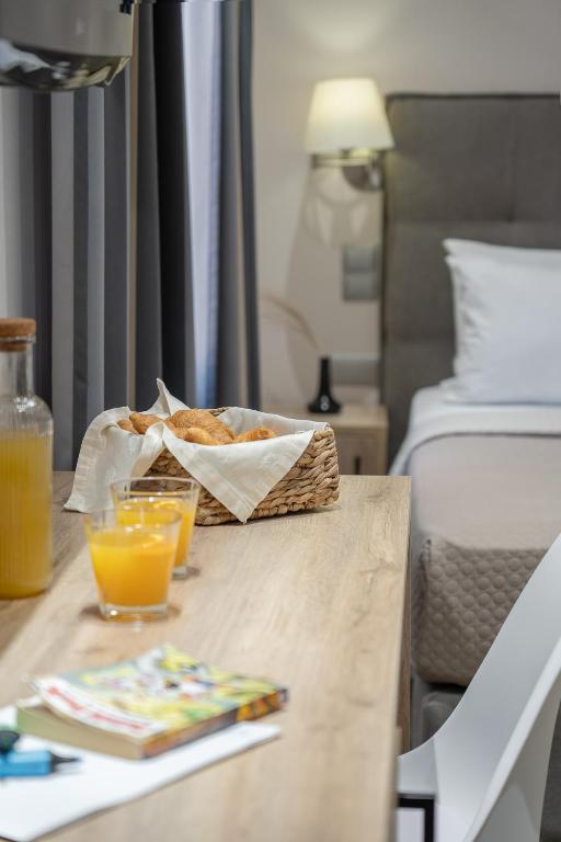 Postel nebo postele na pokoji v ubytování Piraeus City Hotel