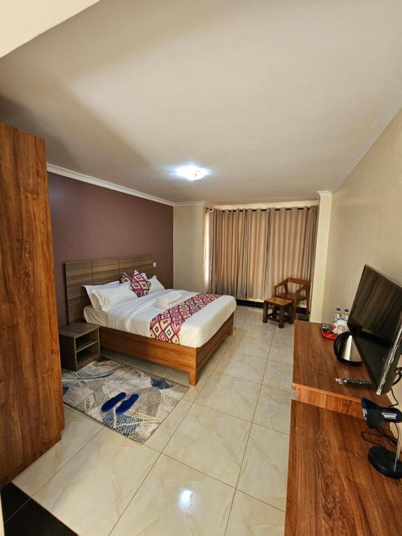 Postel nebo postele na pokoji v ubytování Big Tusks Hotel, Marsabit
